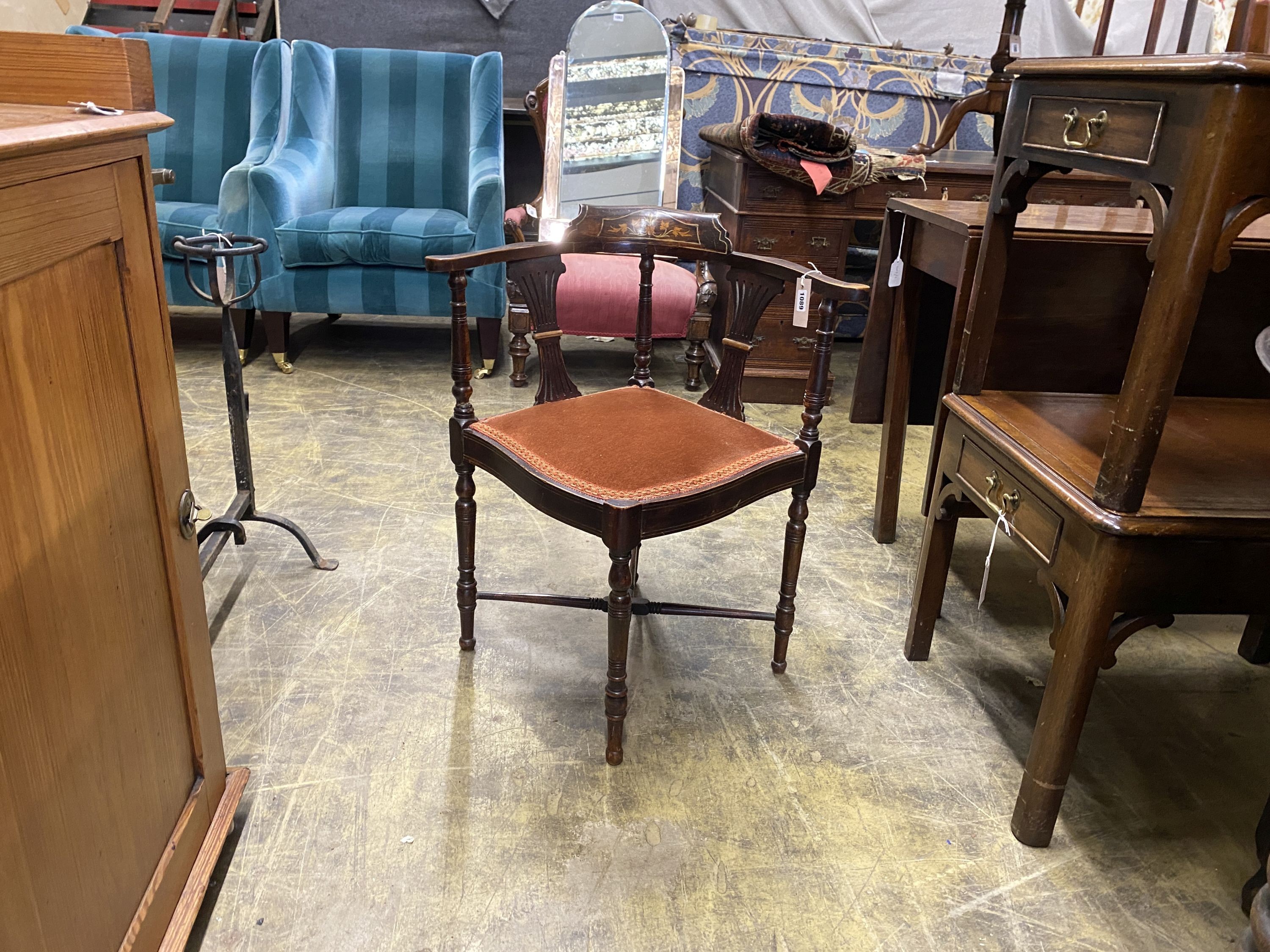 An Edwardian inlaid mahogany corner elbow chair